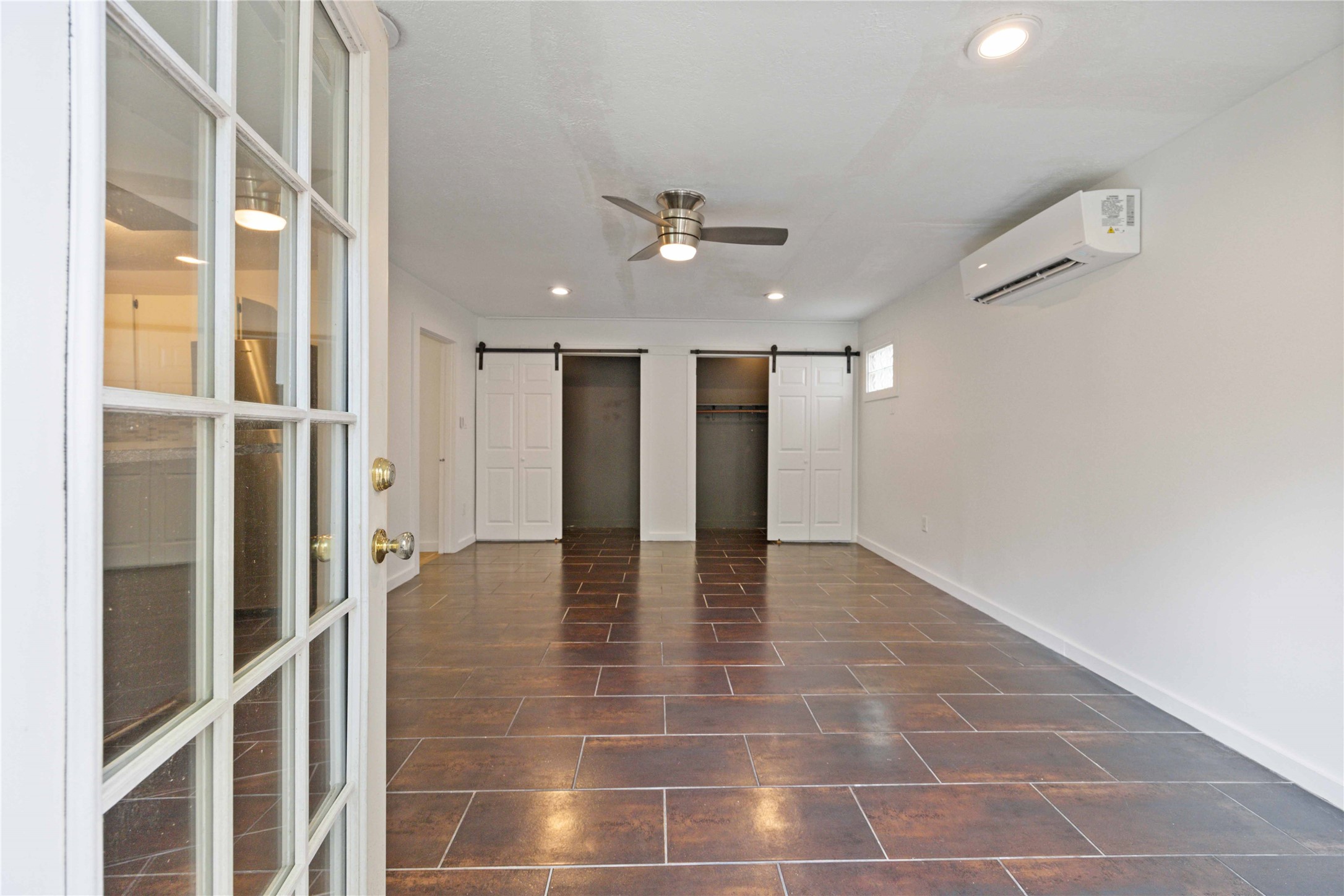 2503 Park Street Houston, TX 77098 - Photo 21 of 23 a view of an entryway with a ceiling fan and kitchen view