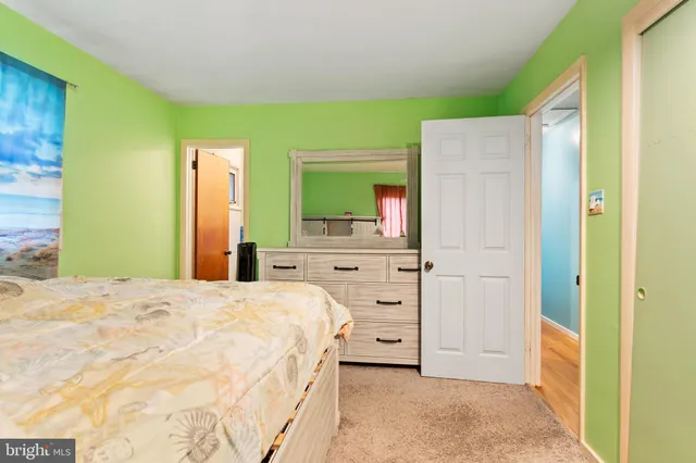 a bedroom with furniture and a window