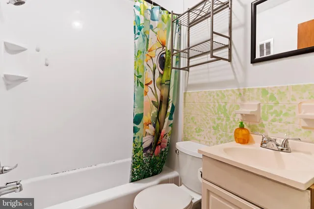 a bedroom with furniture and a wooden floor