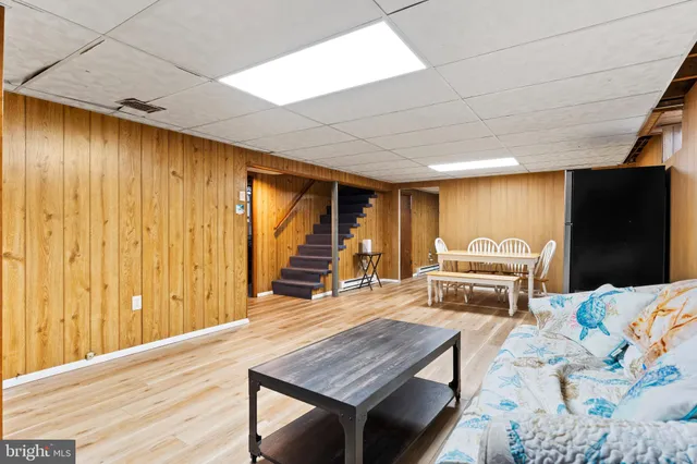 a bedroom with bed and a couch