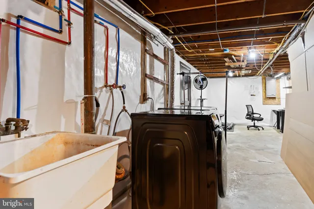 a bedroom with bed and a tv