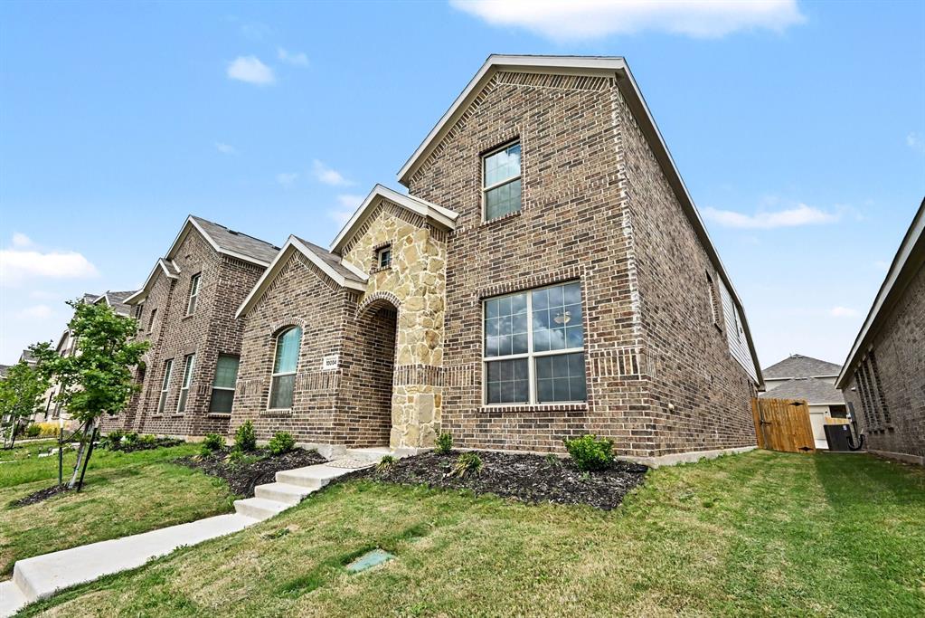 10004 Thornapple Road Fort Worth, TX 76179 - Photo 4 of 39 front view of a house with a yard