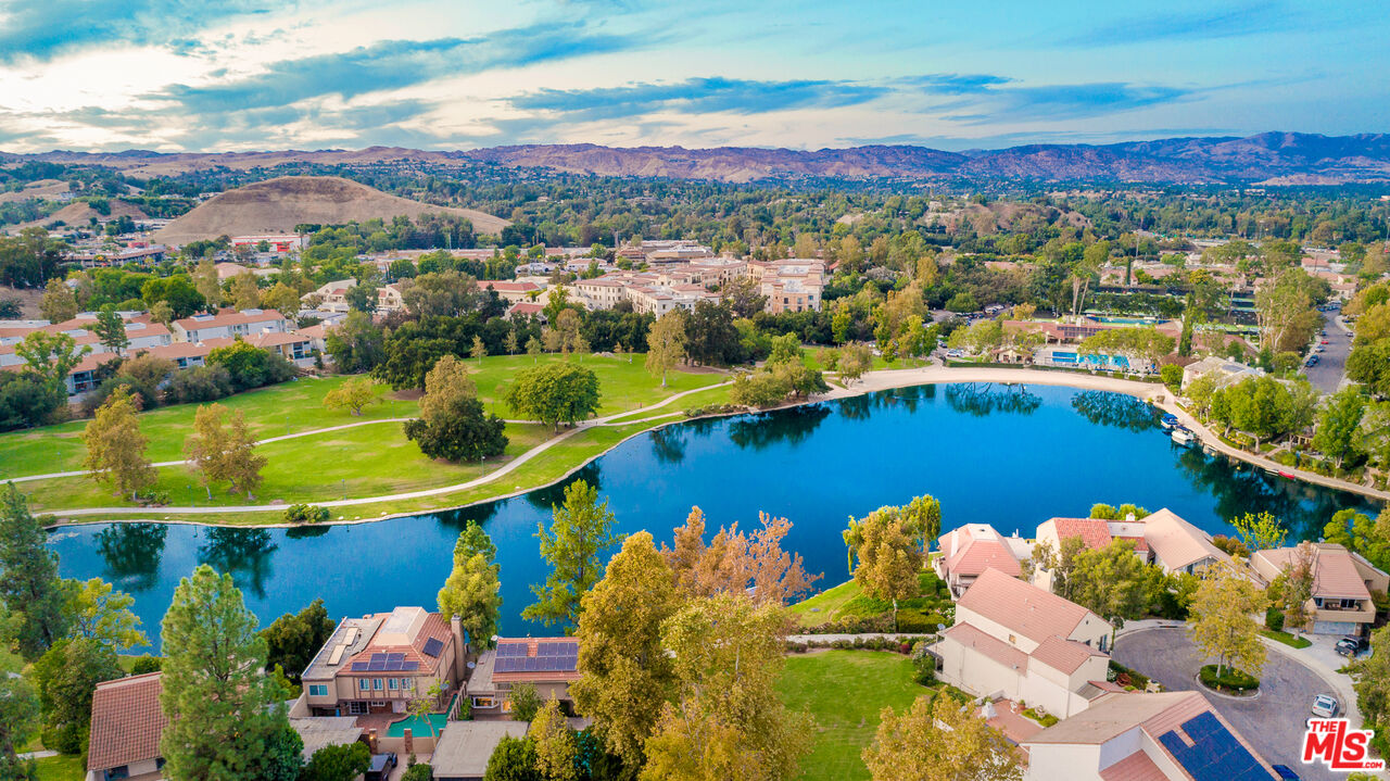 a view of a swimming pool with a table and chairs