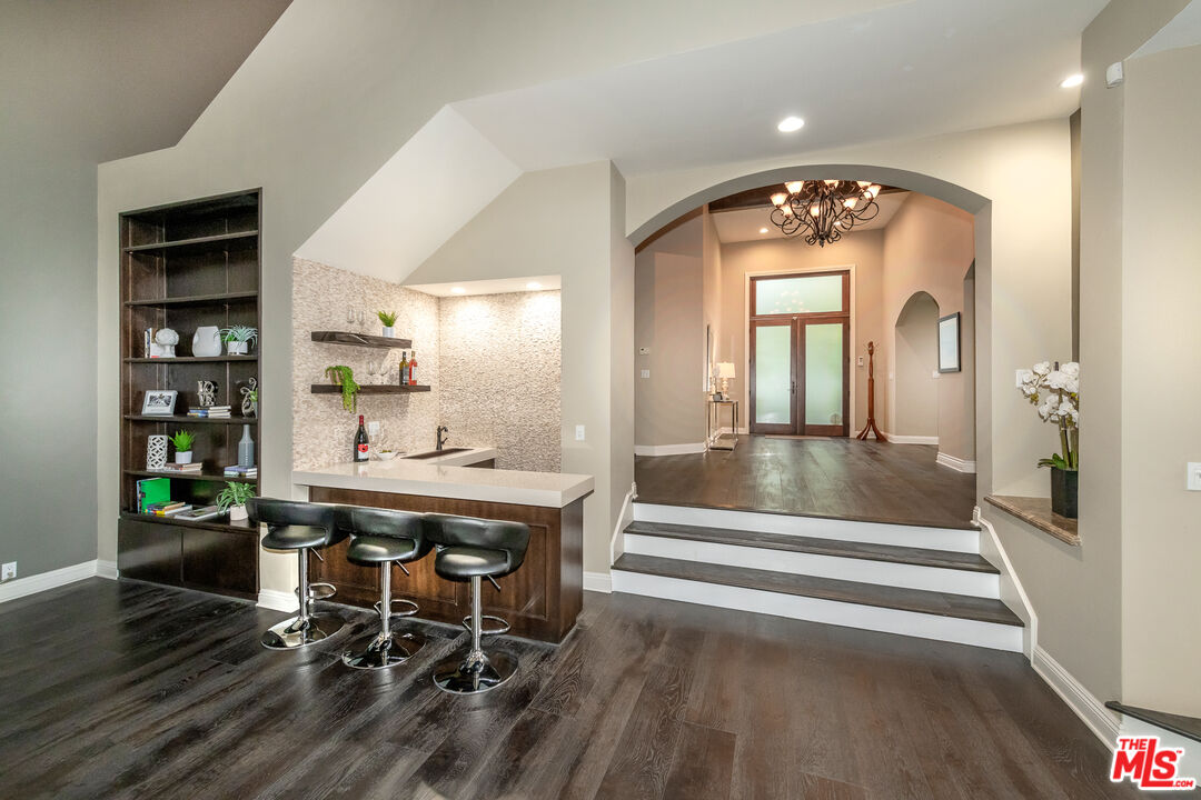 4500 Park Serena Calabasas, CA 91302 - Photo 11 of 34 a view of a hallway with wooden floor and cabinet
