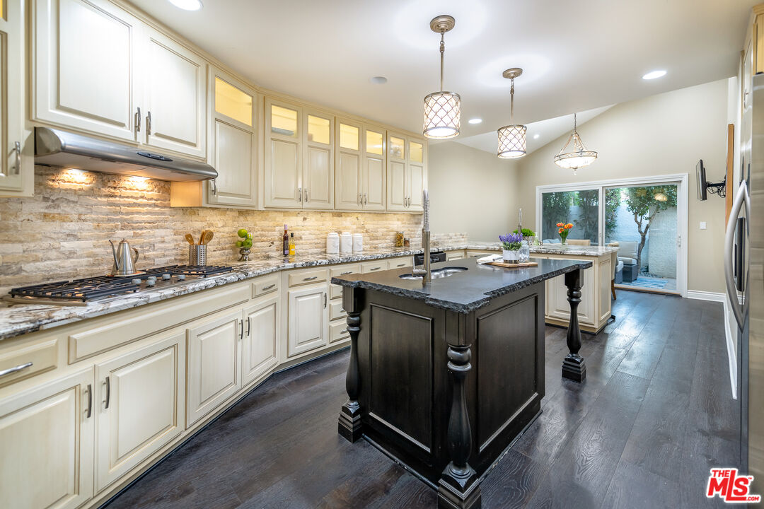 4500 Park Serena Calabasas, CA 91302 - Photo 12 of 34 a kitchen with stainless steel appliances granite countertop a sink stove and cabinets