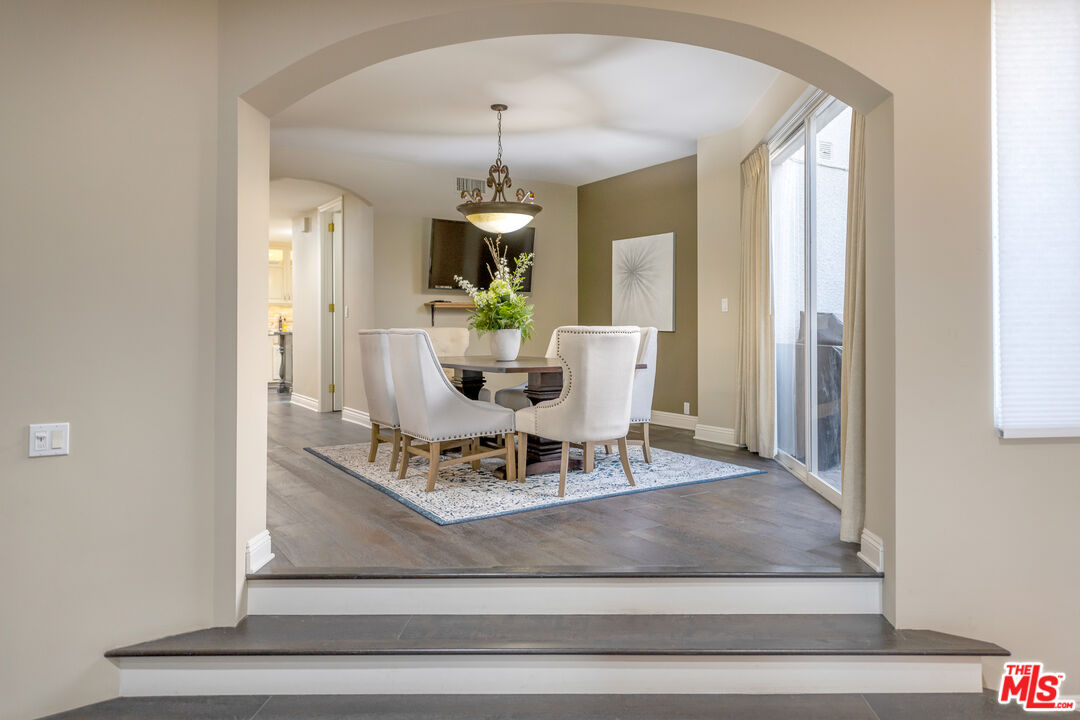 4500 Park Serena Calabasas, CA 91302 - Photo 16 of 34 a view of a dining room with furniture window and wooden floor
