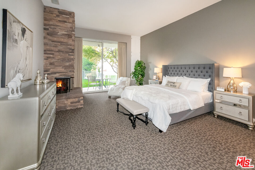 4500 Park Serena Calabasas, CA 91302 - Photo 17 of 34 a bed room with a bed and a couch