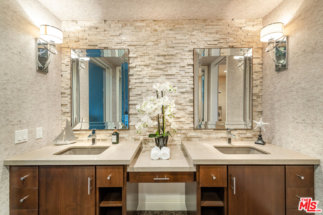 4500 Park Serena Calabasas, CA 91302 - Photo 18 of 34 a bathroom with a sink double vanity and a mirror