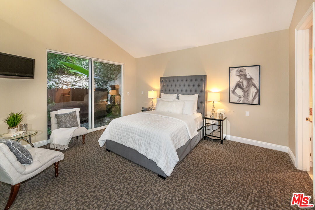 4500 Park Serena Calabasas, CA 91302 - Photo 21 of 34 a bedroom with a bed a couch and large window