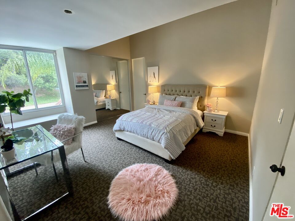 4500 Park Serena Calabasas, CA 91302 - Photo 26 of 34 a bedroom with a bed and wooden floor