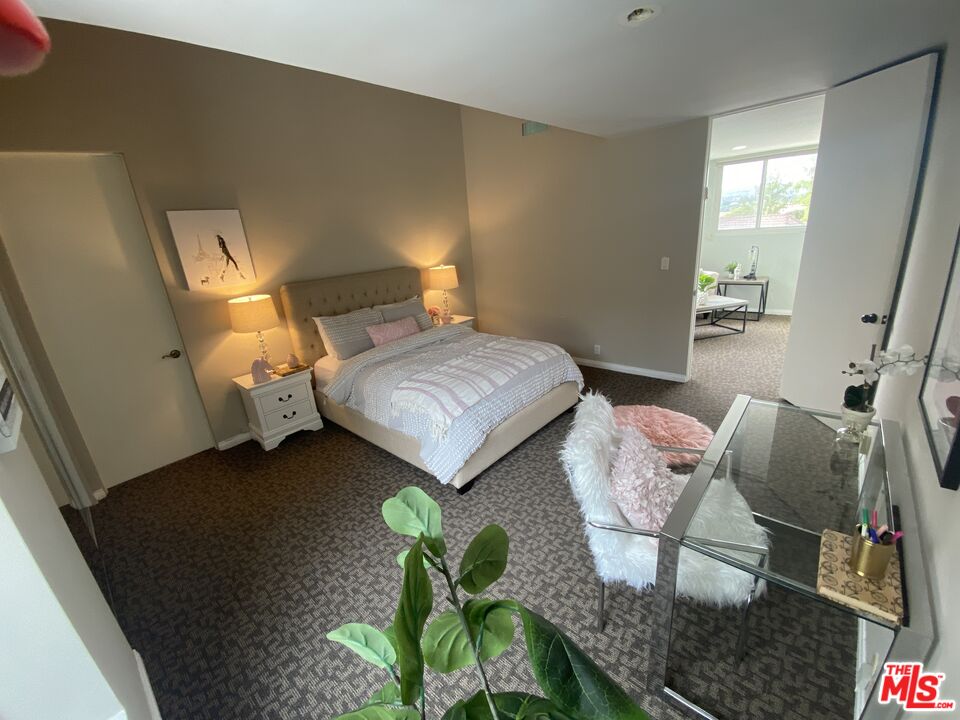 4500 Park Serena Calabasas, CA 91302 - Photo 27 of 34 a bedroom with two beds and a potted plant