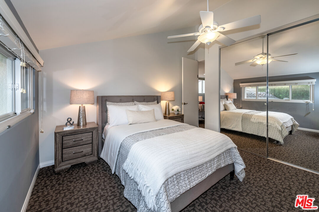 4500 Park Serena Calabasas, CA 91302 - Photo 29 of 34 a bedroom with bed and a chandelier