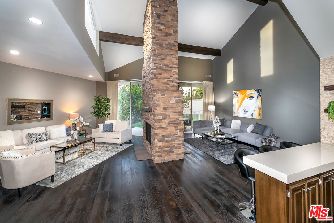 4500 Park Serena Calabasas, CA 91302 - Photo 6 of 34 a living room with fireplace furniture and wooden floor