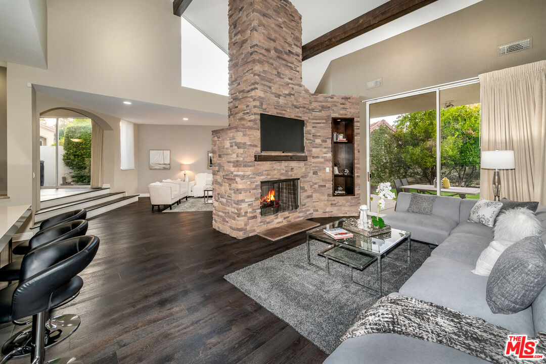 4500 Park Serena Calabasas, CA 91302 - Photo 9 of 34 a living room with furniture fireplace and flat screen tv