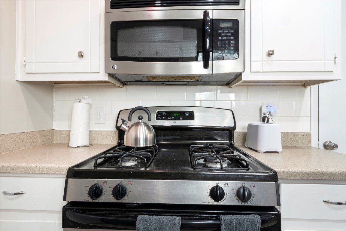 3222 Tamarron Boulevard, Unit A Austin, TX 78746 - Photo 9 of 28 a stove top oven sitting inside of a kitchen