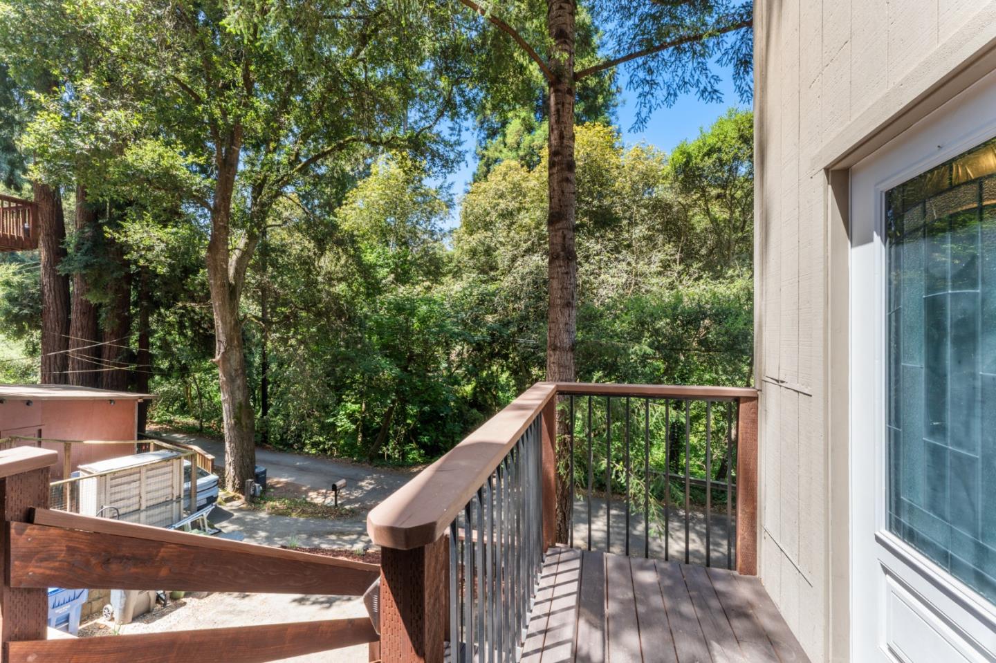 140 Baker Road Aptos, CA 95003 - Photo 3 of 62 a balcony with wooden floor and outdoor seating
