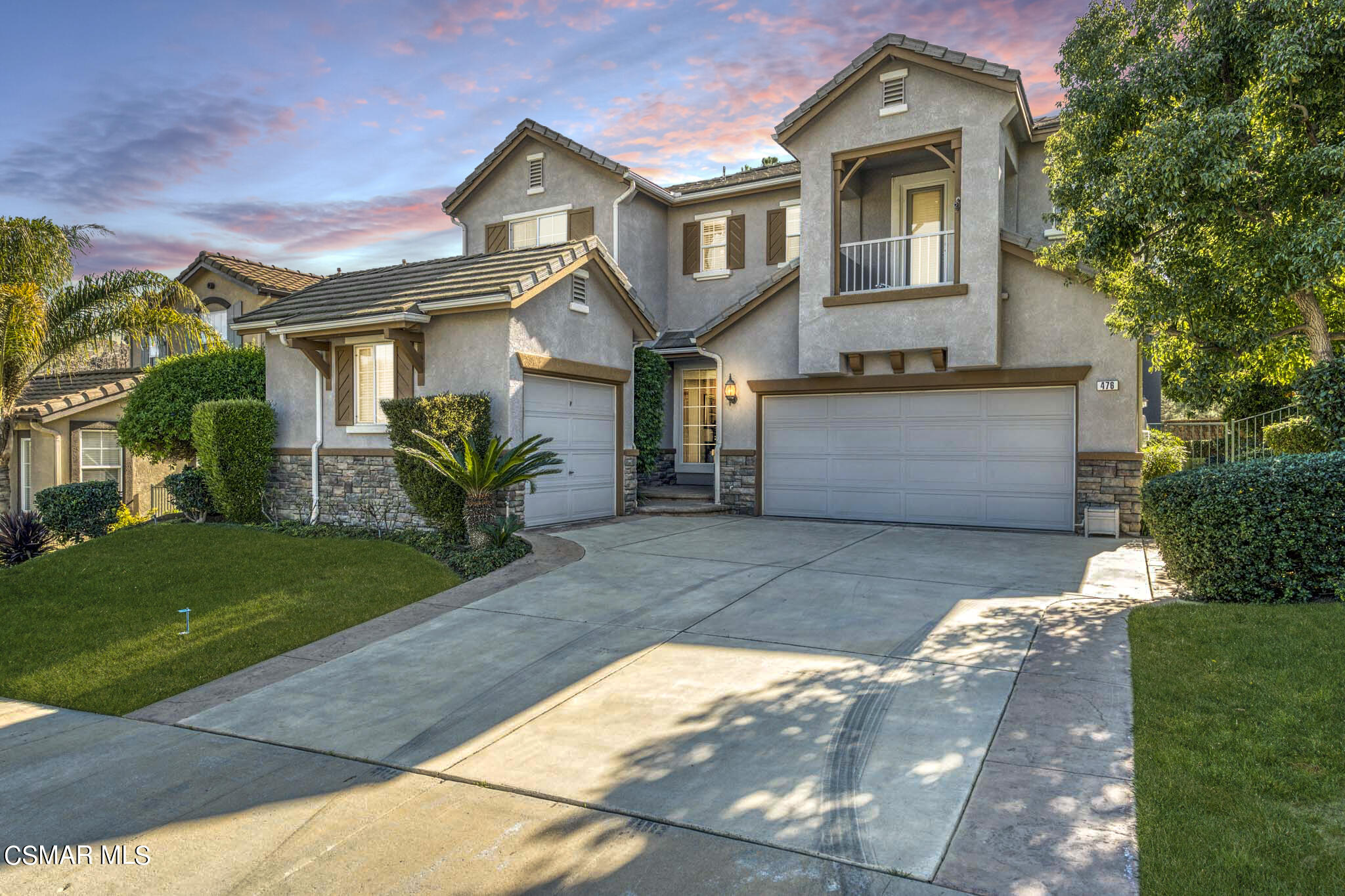 476 Woodland Road Simi Valley, CA 93065 - Photo 1 of 41 a front view of a house with a yard and garage