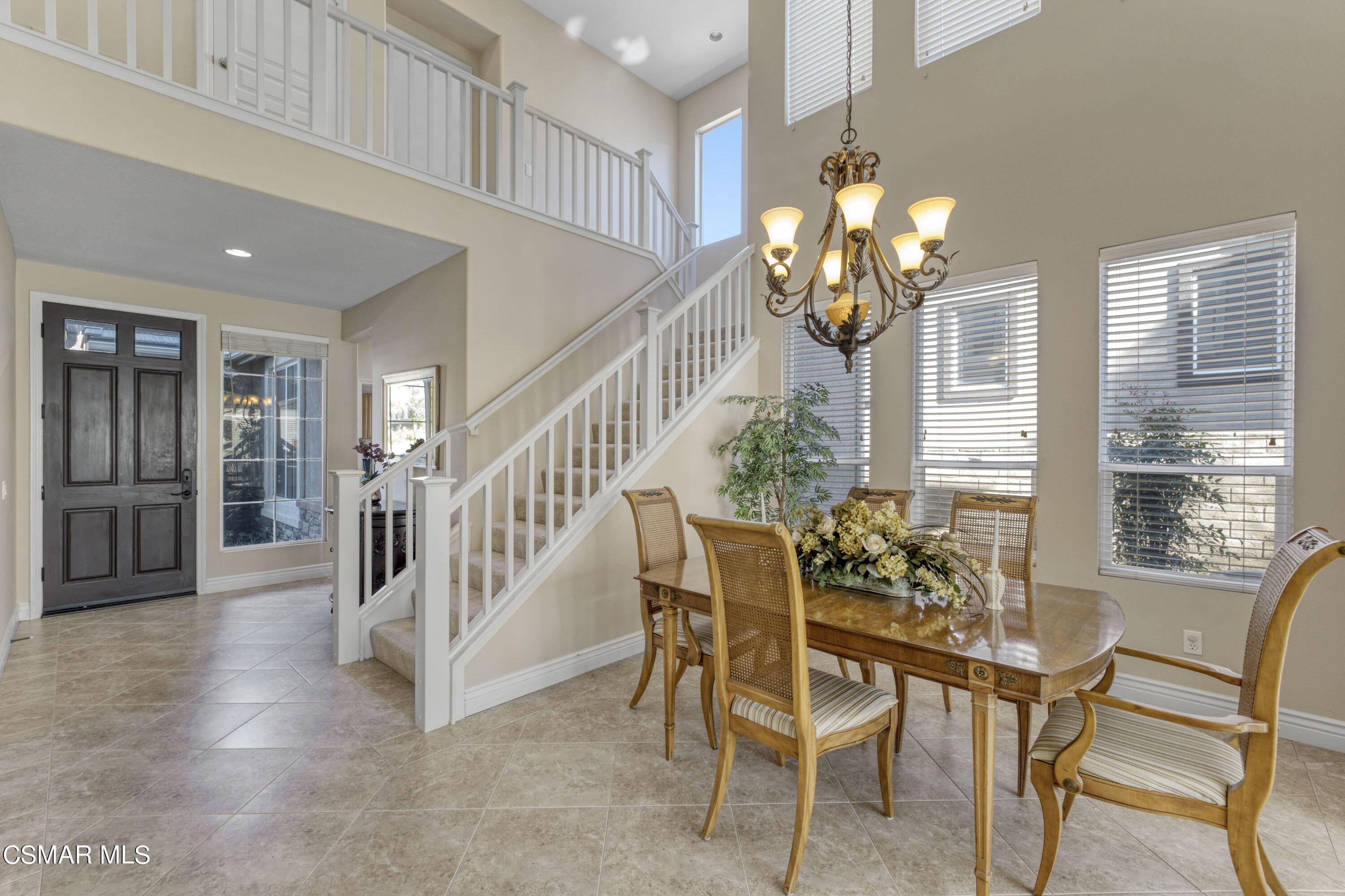 476 Woodland Road Simi Valley, CA 93065 - Photo 12 of 41 a dining room with wooden floor and large windows