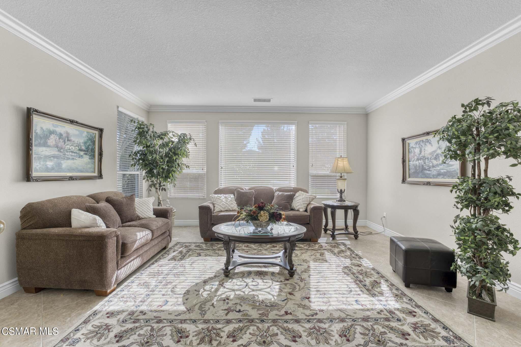 476 Woodland Road Simi Valley, CA 93065 - Photo 14 of 41 a living room with furniture and a potted plant