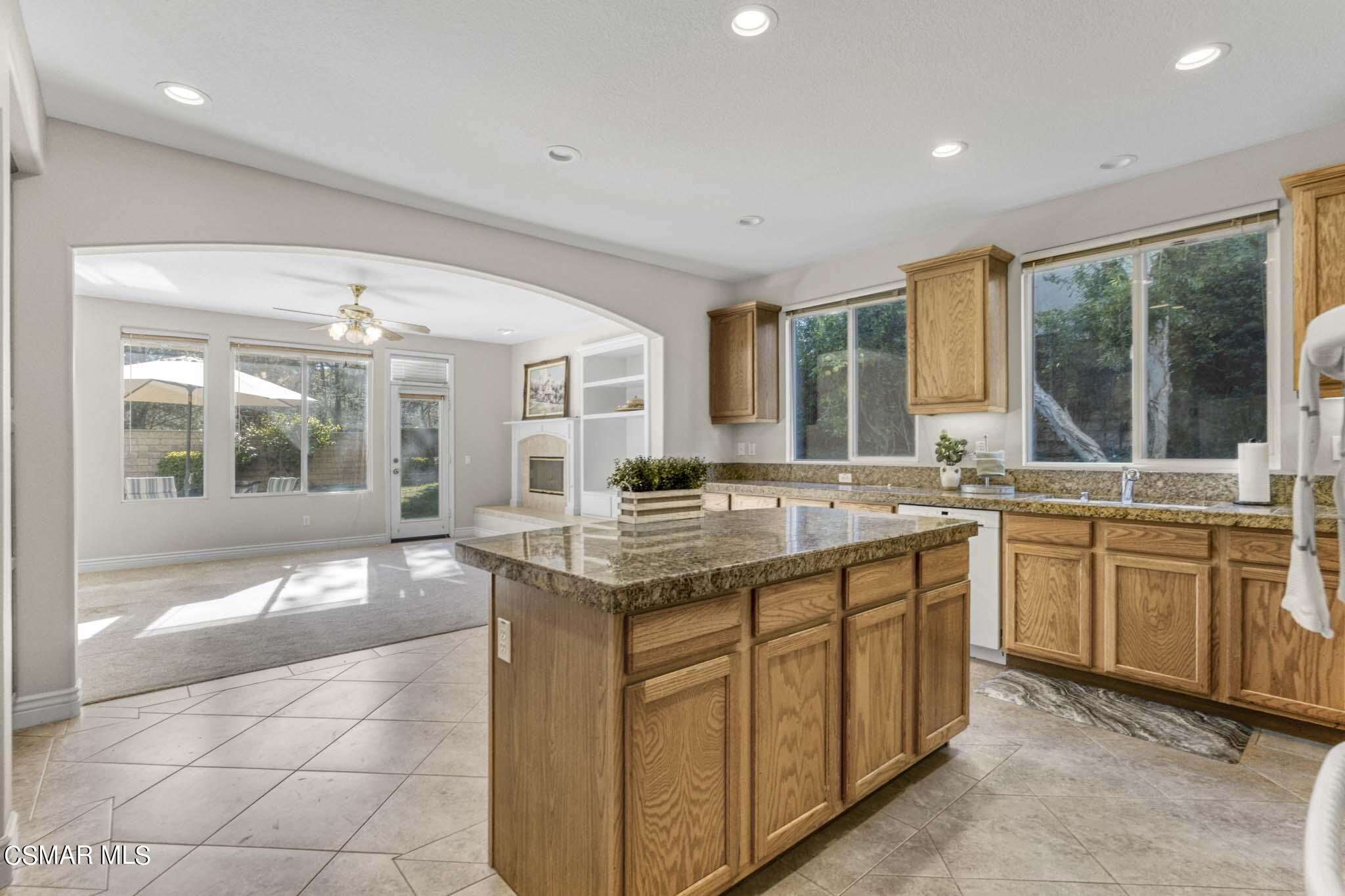 476 Woodland Road Simi Valley, CA 93065 - Photo 17 of 41 a kitchen with granite countertop a sink and cabinets