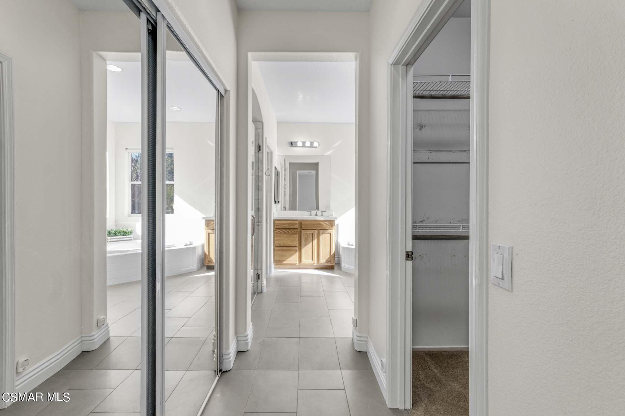 476 Woodland Road Simi Valley, CA 93065 - Photo 25 of 41 a bathroom with a glass shower door and a mirror