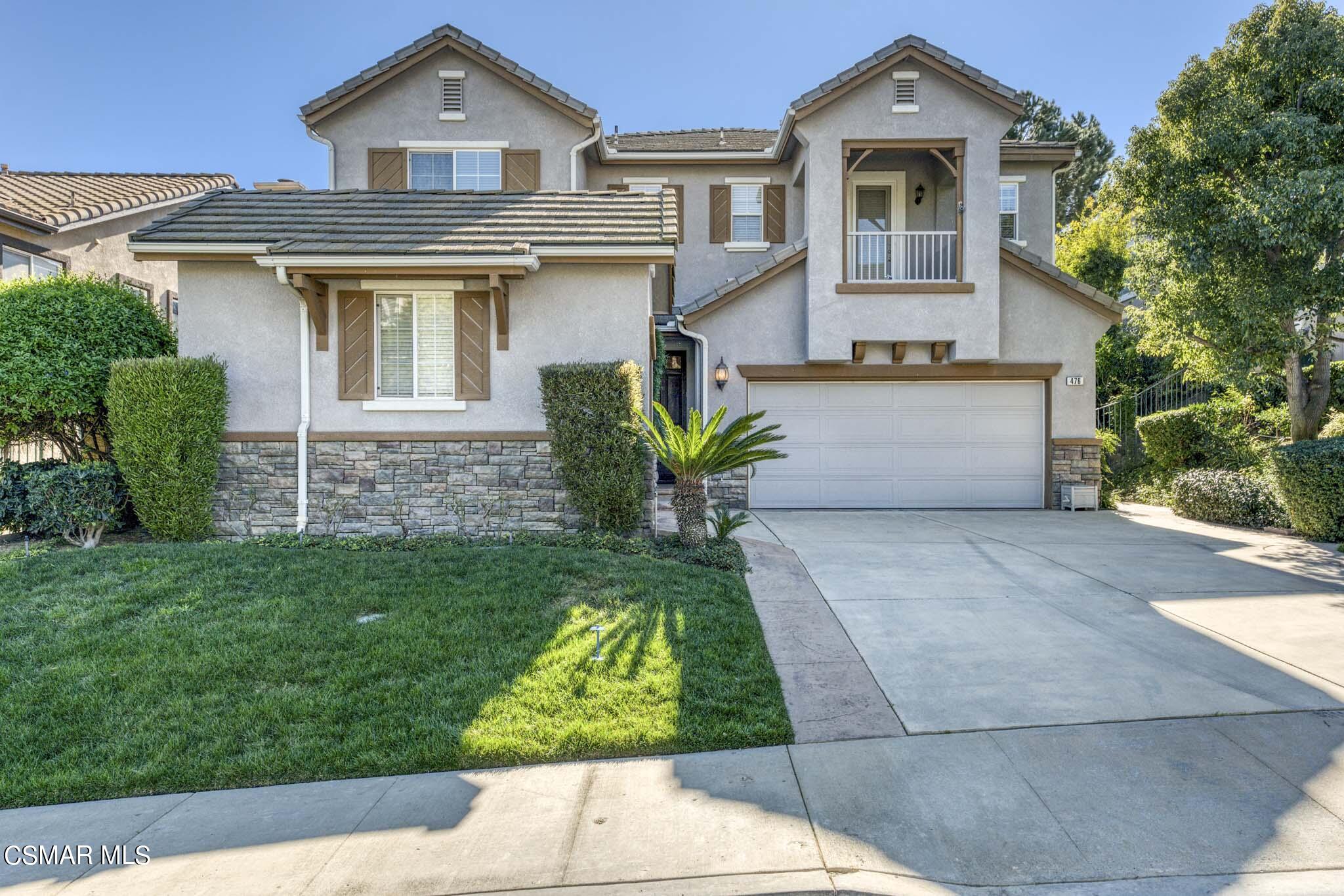 476 Woodland Road Simi Valley, CA 93065 - Photo 3 of 41 a front view of a house with a garden