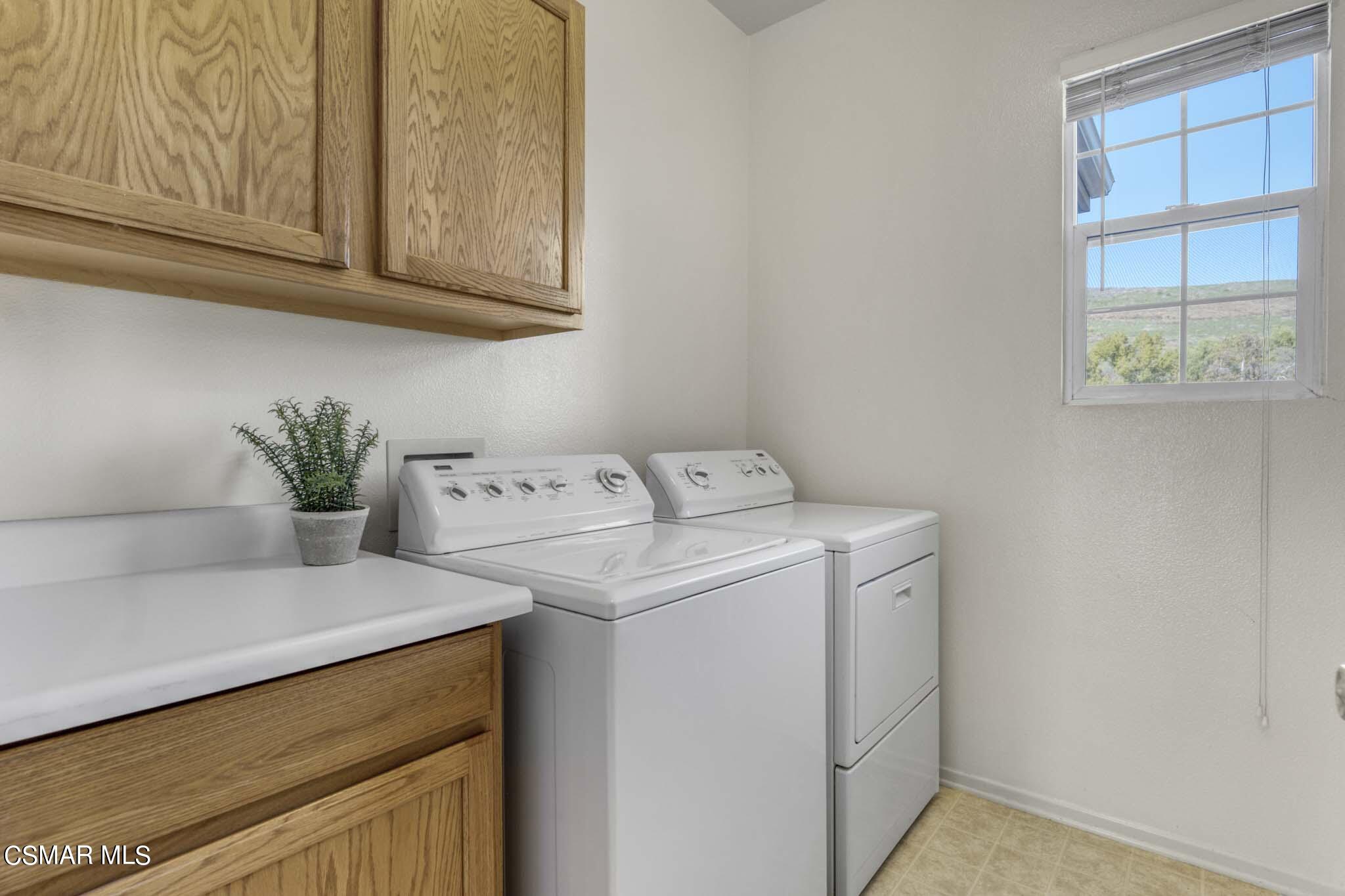 476 Woodland Road Simi Valley, CA 93065 - Photo 37 of 41 a utility room with dryer and washer