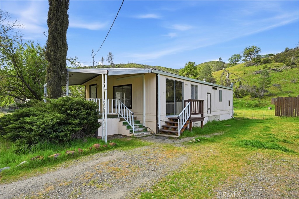 a view of a back yard of the house