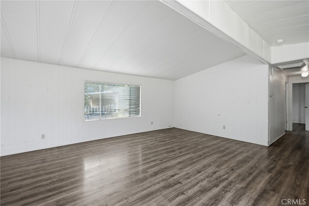3795 Spring Valley Road Clearlake Oaks, CA 95423 - Photo 11 of 31 a view of an empty room with wooden floor and a window