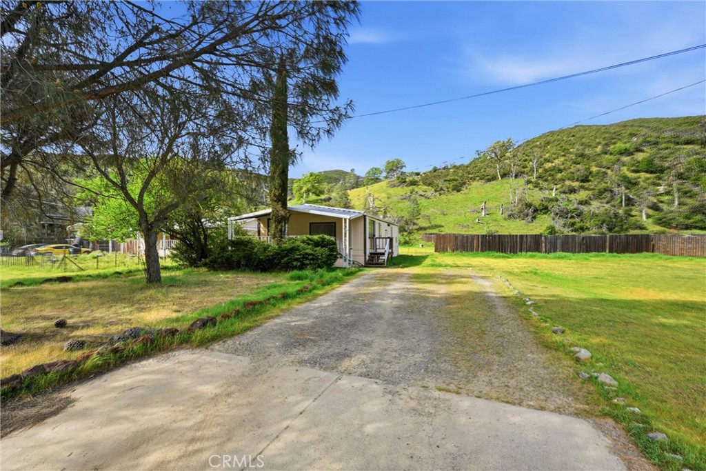 3795 Spring Valley Road Clearlake Oaks, CA 95423 - Photo 2 of 31 a view of a house with a yard