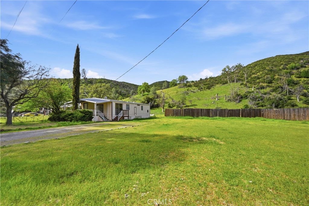3795 Spring Valley Road Clearlake Oaks, CA 95423 - Photo 25 of 31 a view of a house with a big yard