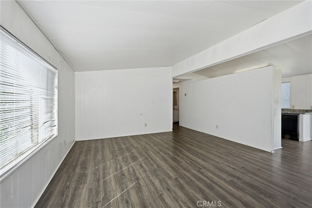 3795 Spring Valley Road Clearlake Oaks, CA 95423 - Photo 5 of 31 a view of an empty room with wooden floor and a window