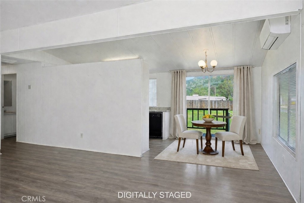 3795 Spring Valley Road Clearlake Oaks, CA 95423 - Photo 8 of 31 a view dining room with furniture a potted plant and wooden floor