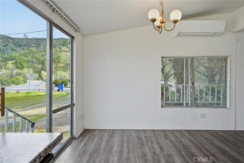 3795 Spring Valley Road Clearlake Oaks, CA 95423 - Photo 10 of 31 a view of a room with wooden floor and windows