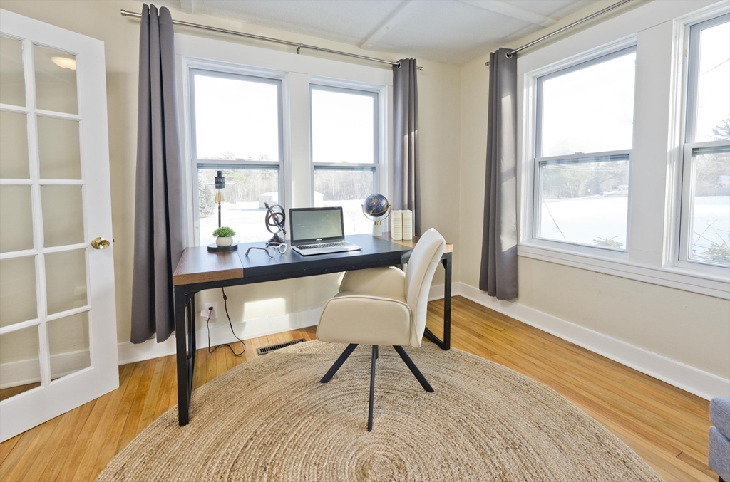 137 Old Amherst Road Belchertown, MA 01007 - Photo 13 of 42 a view of a workspace with furniture and a window