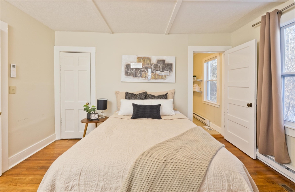 137 Old Amherst Road Belchertown, MA 01007 - Photo 16 of 42 a bedroom with a bed and wooden floor