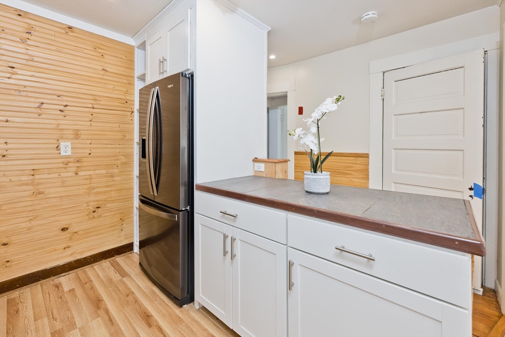 137 Old Amherst Road Belchertown, MA 01007 - Photo 26 of 42 a kitchen with a refrigerator and window