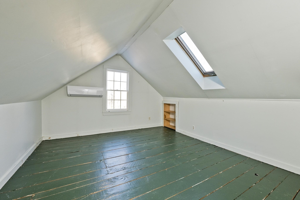 137 Old Amherst Road Belchertown, MA 01007 - Photo 33 of 42 an empty room with wooden floor and windows
