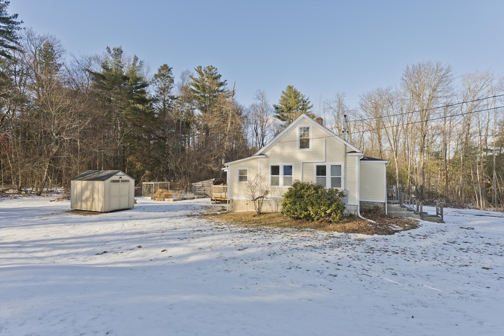 137 Old Amherst Road Belchertown, MA 01007 - Photo 5 of 42 a front view of a house with a yard