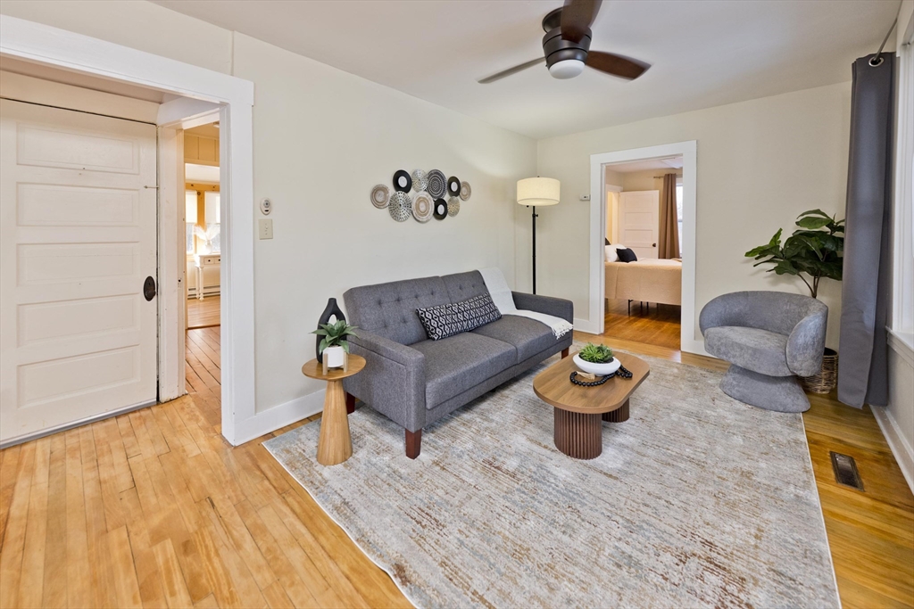 137 Old Amherst Road Belchertown, MA 01007 - Photo 10 of 42 a living room with furniture and a wooden floor