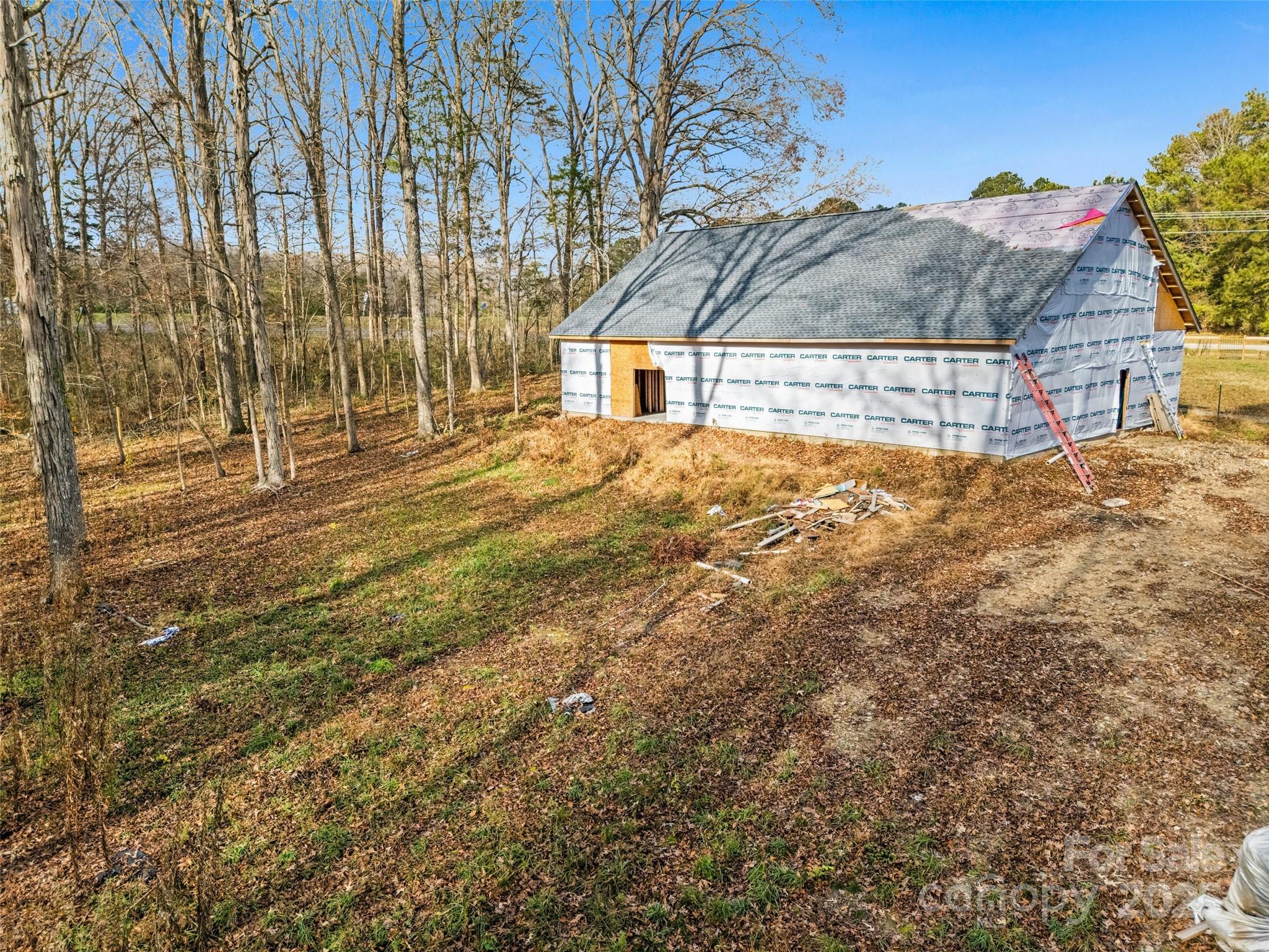 6027 Campbell Road York, SC 29745 - Photo 8 of 10 a view of house with backyard