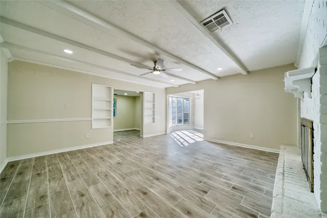 an aerial view of residential houses with outdoor space and street view