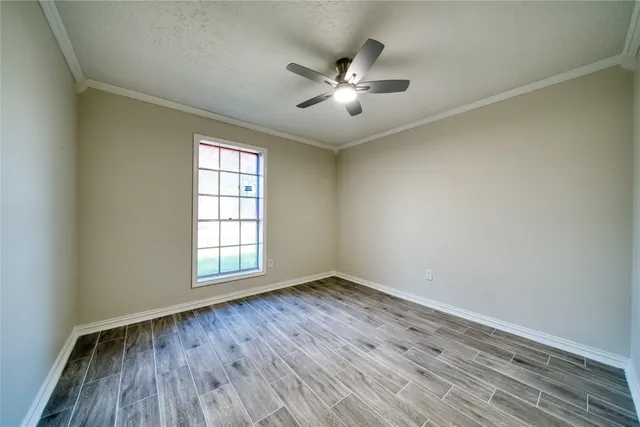 a bathroom with a granite countertop sink a toilet and bathtub