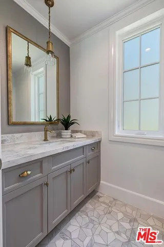 a bathroom with a double vanity sink and a bathtub
