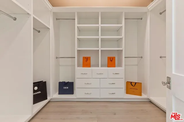 a kitchen with stainless steel appliances granite countertop a kitchen island a stove and a sink