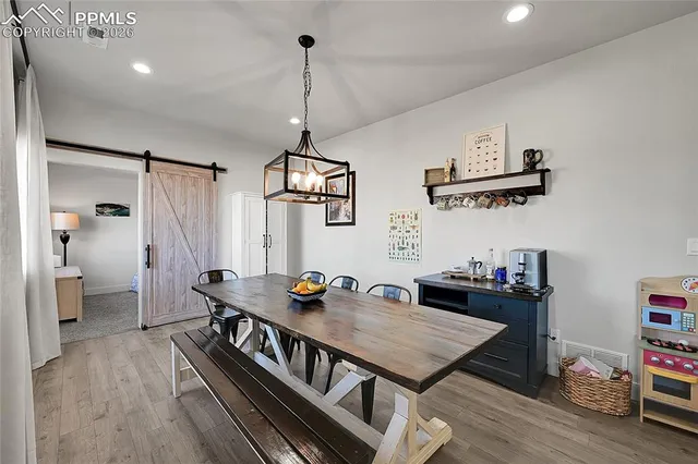 a bed room with a bed and a ceiling fan