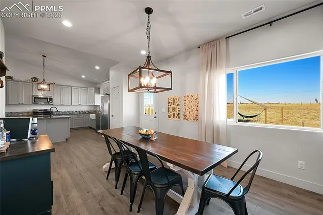 a bed room with a bed and a ceiling fan