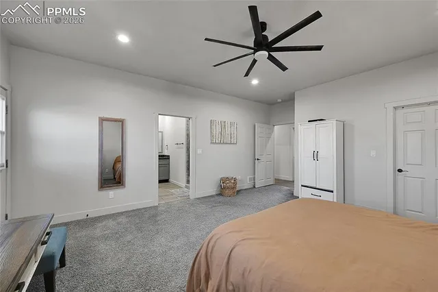 a front view of a house with a yard and lake view