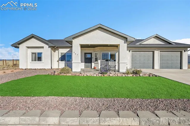 a kitchen with granite countertop white cabinets and stainless steel appliances