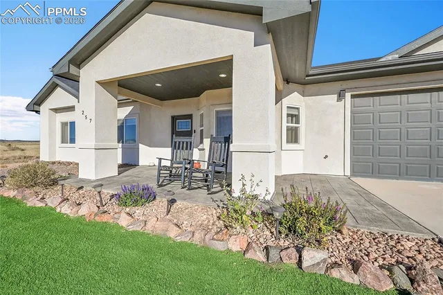 a kitchen with stainless steel appliances granite countertop a sink a stove and a wooden floors